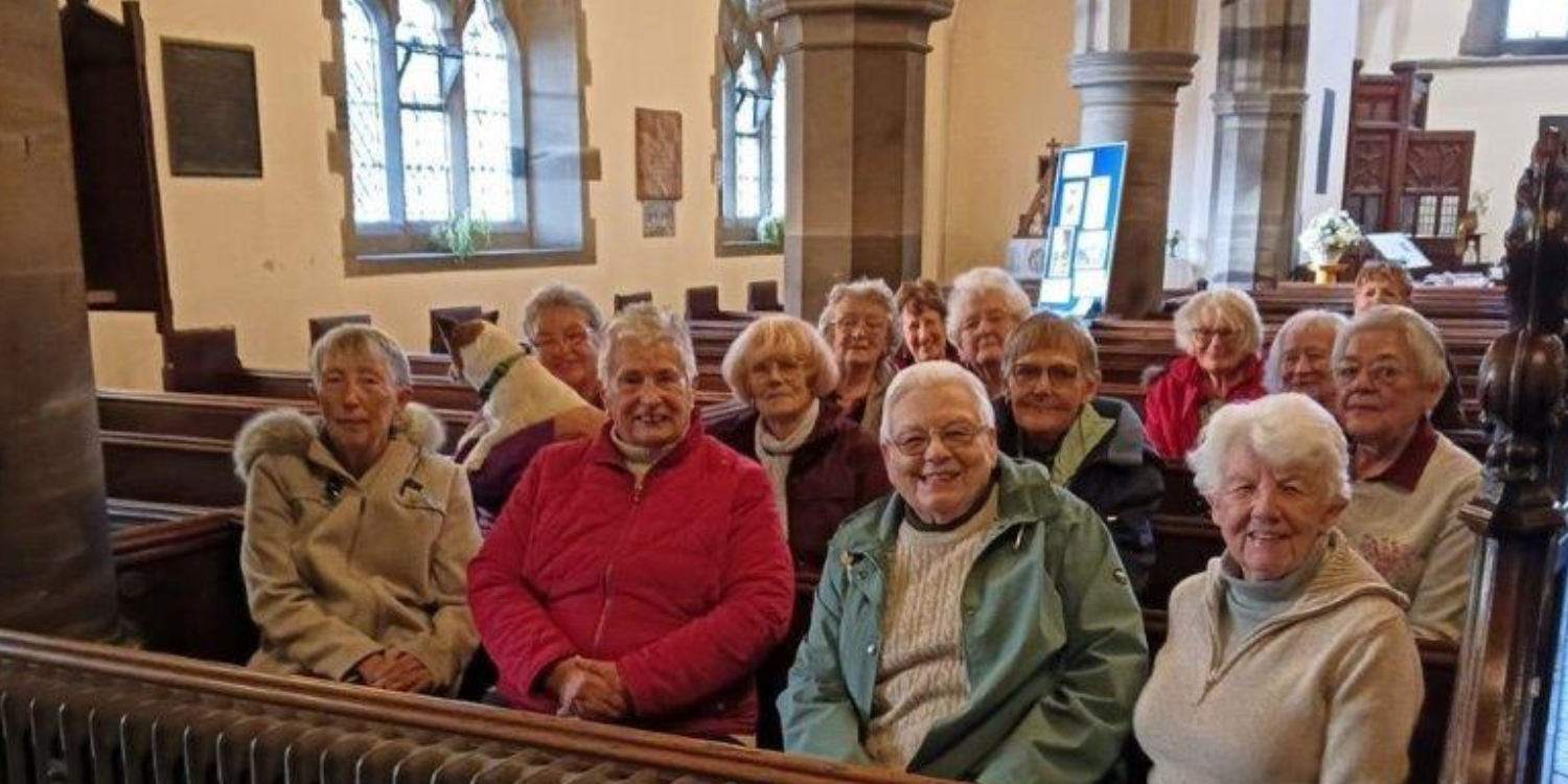 Wednesday Women's Club sat in pews Holy Trinty toasting their feet on new heaters
