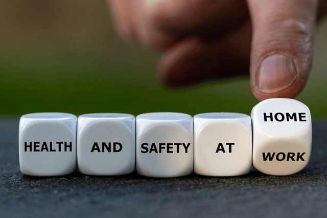 cubes lined up with writing on them saying health and safety