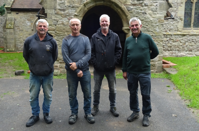 Group of four men stood in front of St Mary's Church Stottesdon