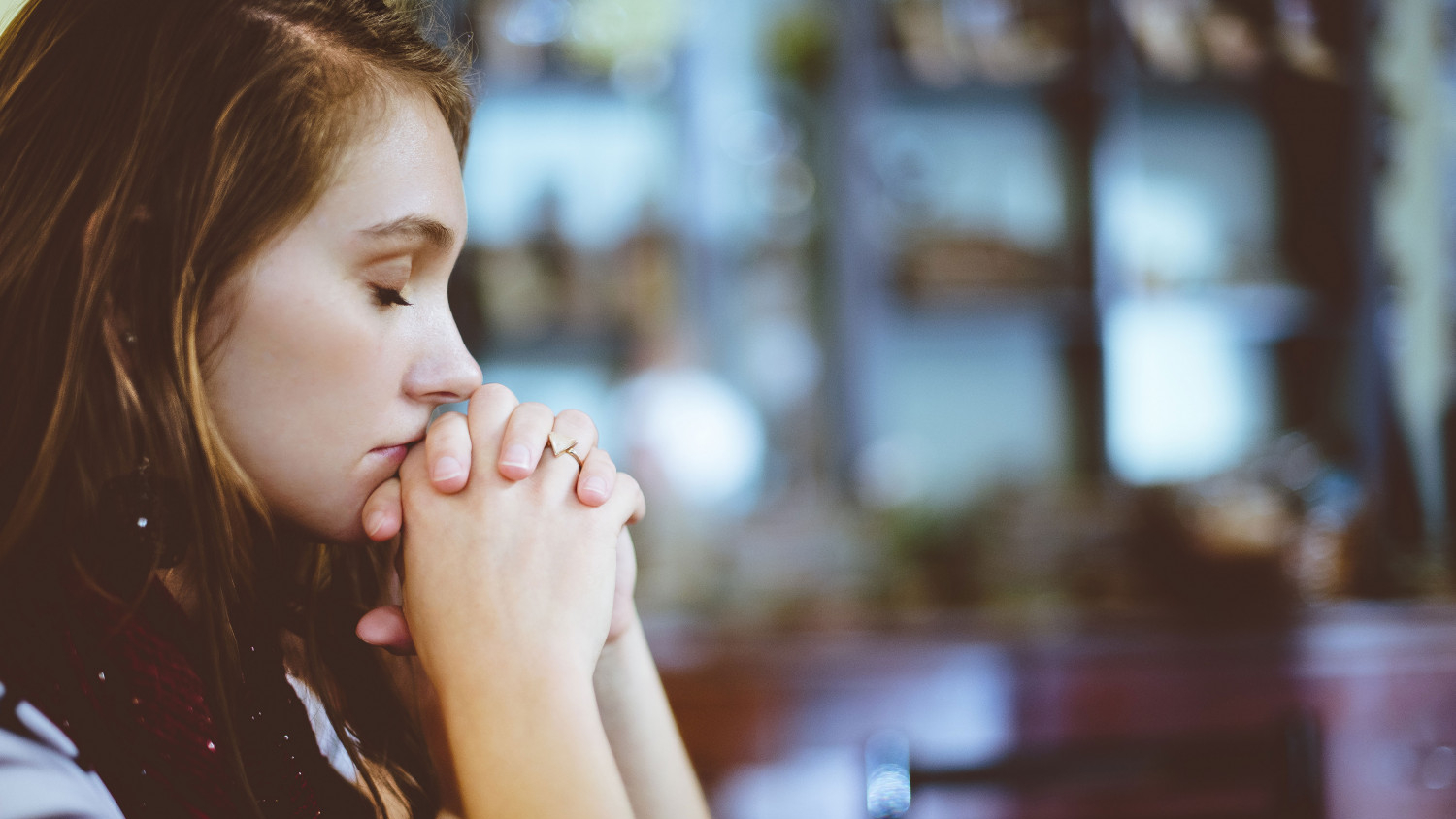 Image of a group of women praying together