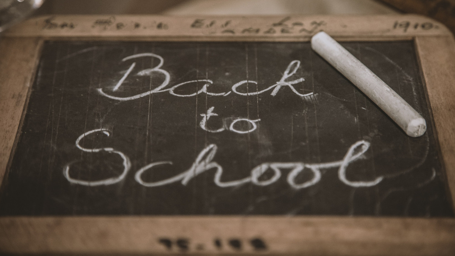 Image of chalkboard with the words 'back to school' in chalk