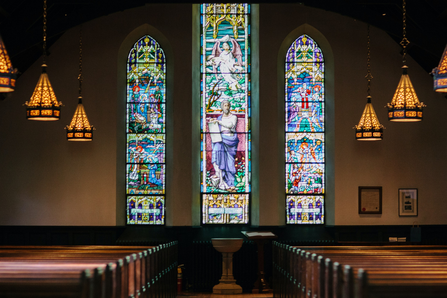 Image of stained glass windows inside of a church 
