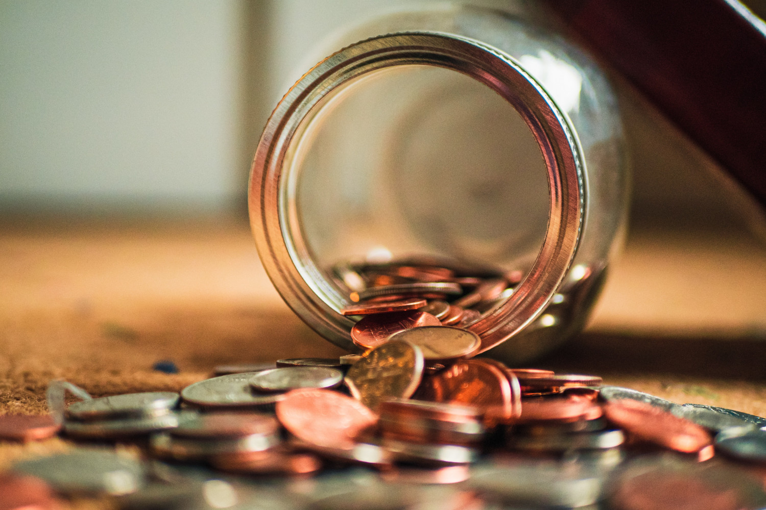 Image of an overturned jar of coins