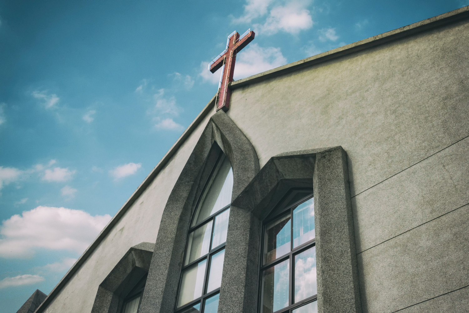 Image of a close-up, angled view of the top of a church building