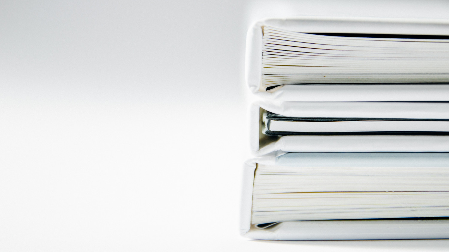 Image of white folder binders on a white background