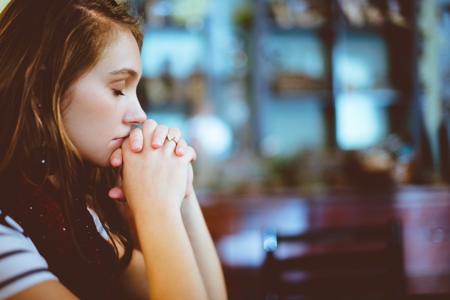 Woman praying' sign