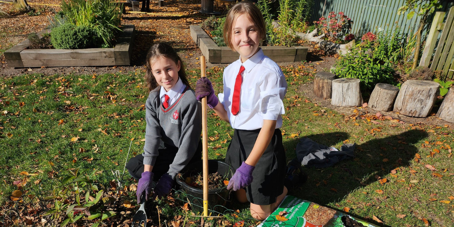 Children at St Thomas Cantilupe Primary School taking care of the school's quiet reflection area